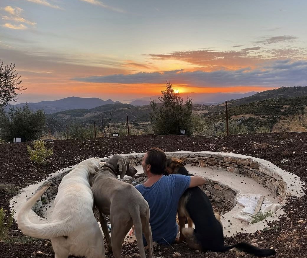 Rifat with his three dogs at sunset, Eagle Nest